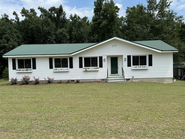 ranch-style house featuring crawl space, metal roof, and a front lawn