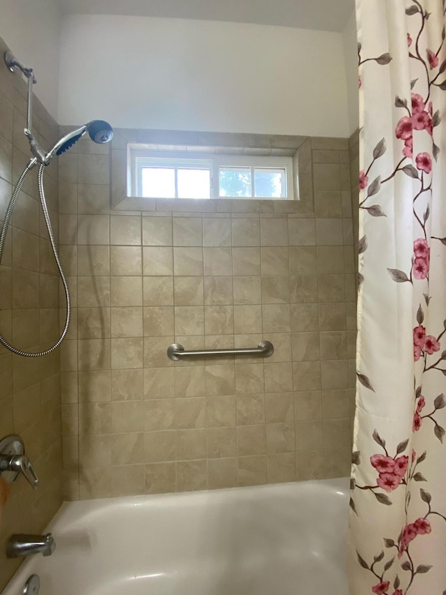 full bath with a healthy amount of sunlight and shower / bath combo with shower curtain