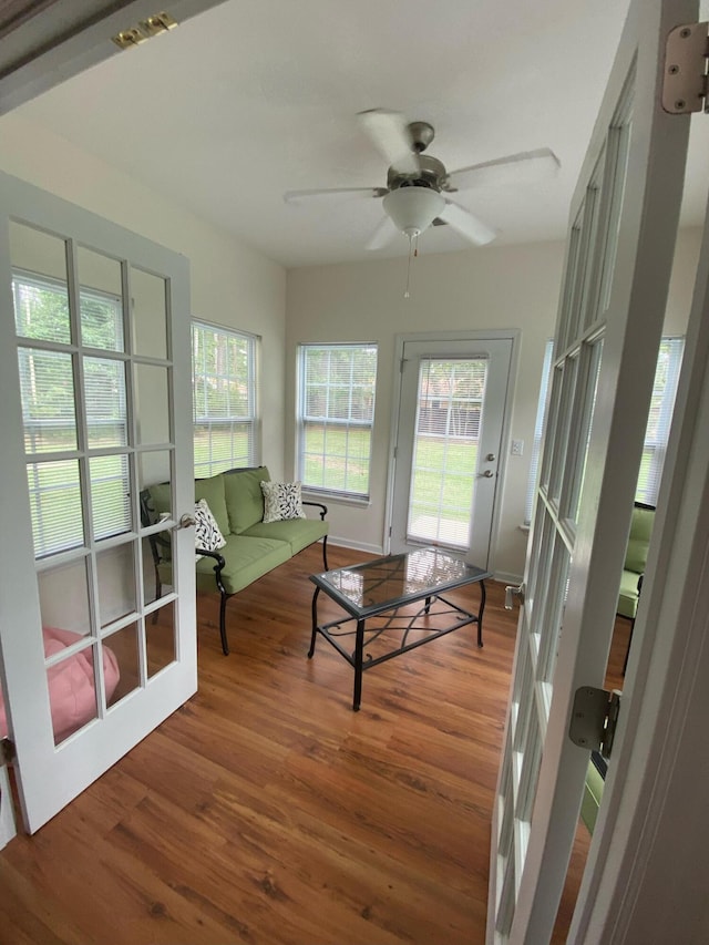 sunroom featuring ceiling fan