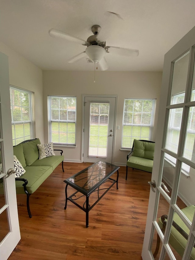 sunroom with a ceiling fan