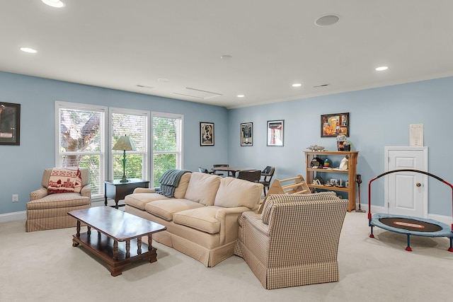living room with carpet floors, recessed lighting, and baseboards