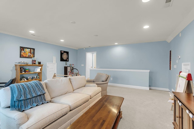 living area with recessed lighting, baseboards, visible vents, and light carpet