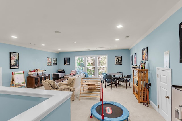 living area with baseboards, visible vents, recessed lighting, and light colored carpet