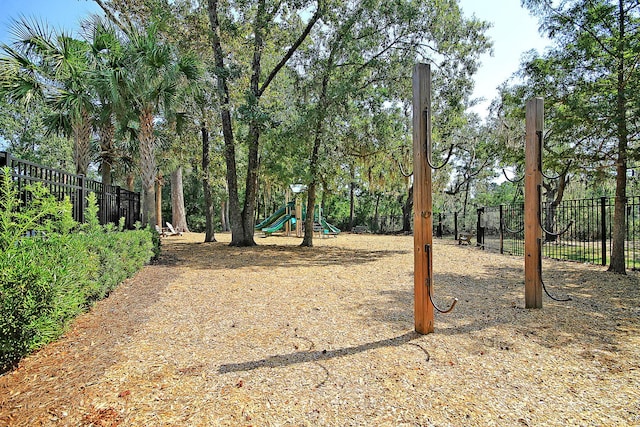 view of yard with fence and playground community