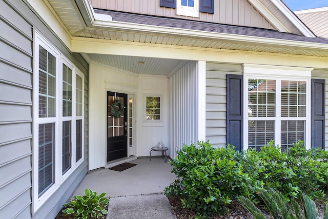 doorway to property featuring board and batten siding