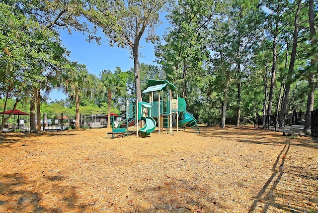 community jungle gym featuring fence