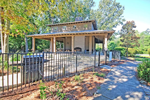 exterior space featuring fence, a chimney, and a patio area