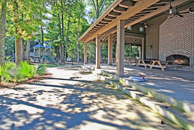 view of home's community with fence and playground community