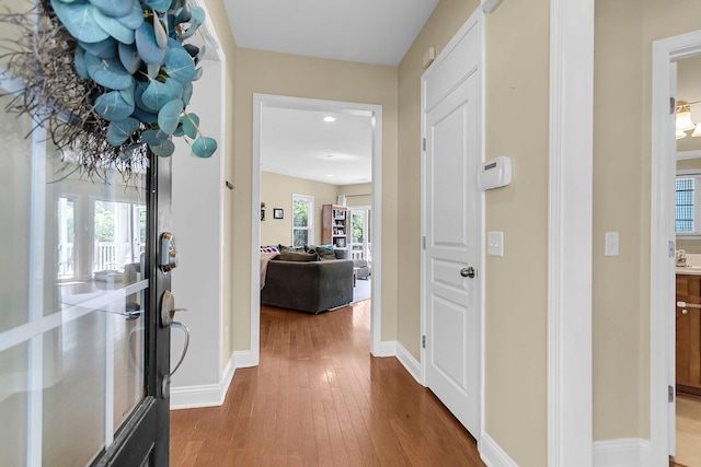 entryway with recessed lighting, baseboards, and hardwood / wood-style floors