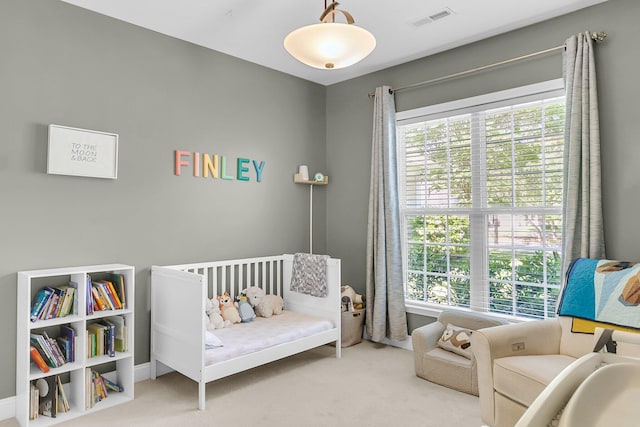 bedroom featuring carpet flooring and visible vents