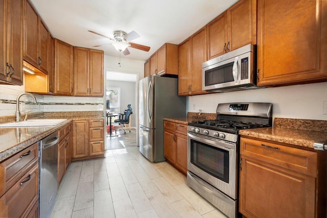 kitchen featuring sink, ceiling fan, and appliances with stainless steel finishes