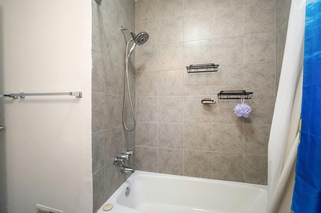 bathroom featuring shower / bathtub combination with curtain