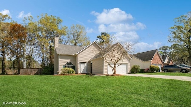 view of front property with a front yard and a garage