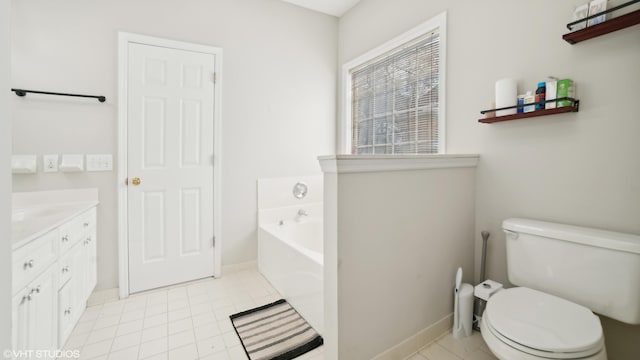 bathroom with a tub to relax in, vanity, tile patterned flooring, and toilet