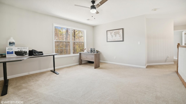 office space with ceiling fan and light colored carpet