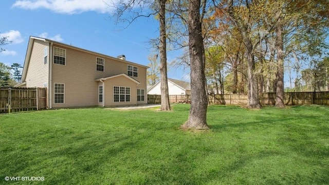 back of house featuring a yard