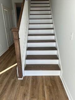 stairs with wood-type flooring