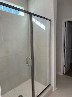 bathroom featuring tile patterned floors and walk in shower