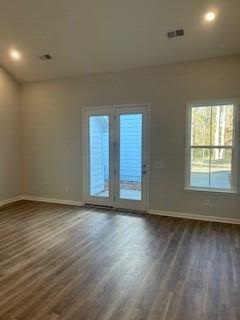 empty room featuring dark hardwood / wood-style floors