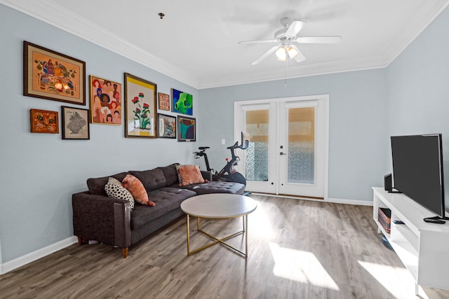 living room featuring french doors, wood-type flooring, ceiling fan, and crown molding