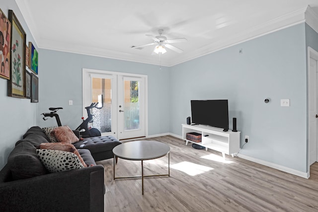 living room featuring ornamental molding, ceiling fan, and light hardwood / wood-style floors