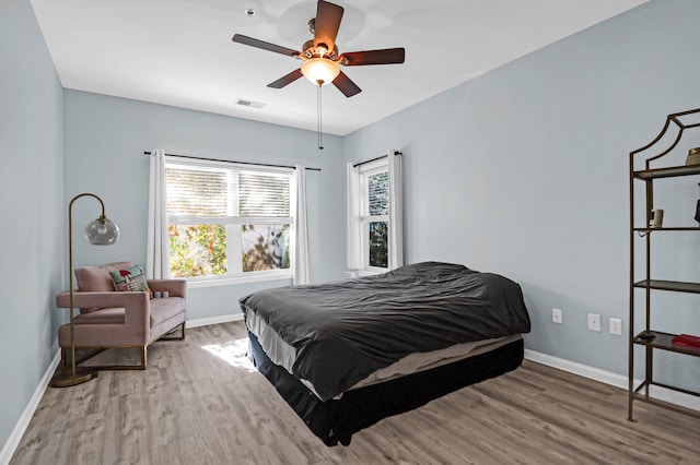 bedroom featuring wood-type flooring and ceiling fan