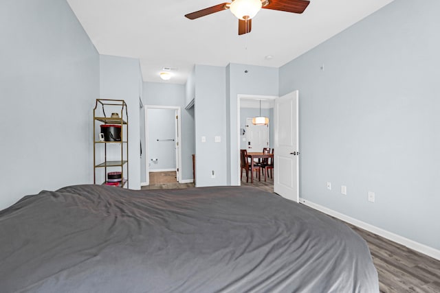 bedroom featuring dark wood-type flooring and ceiling fan