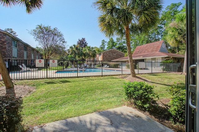 view of yard with a community pool