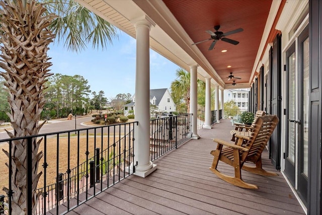 wooden deck with ceiling fan and a porch