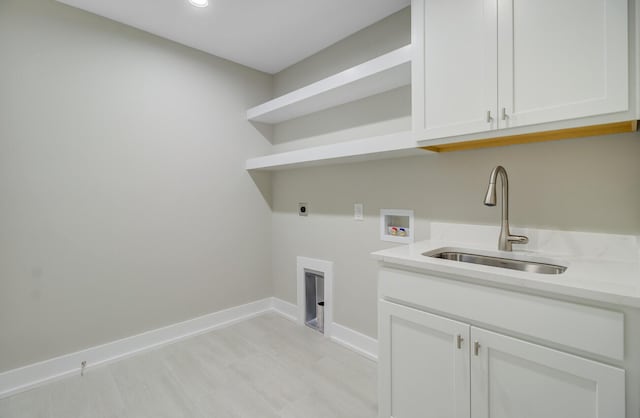 clothes washing area with cabinet space, hookup for an electric dryer, hookup for a washing machine, baseboards, and recessed lighting