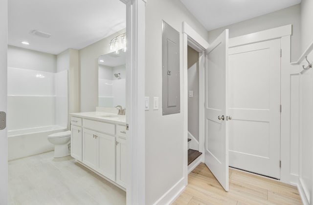 full bathroom featuring vanity, wood finished floors, toilet, and shower / bath combination