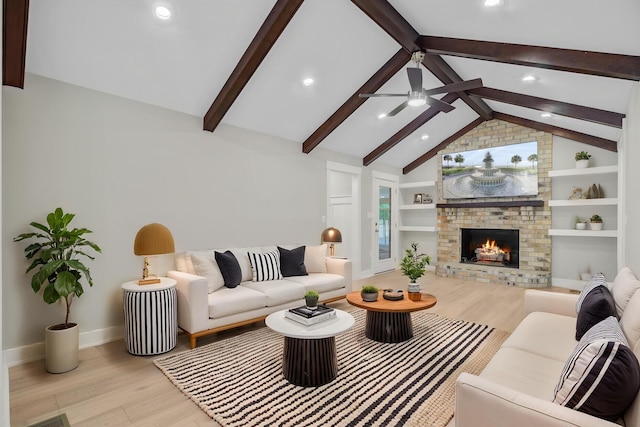 living room featuring wood finished floors, a fireplace, baseboards, a ceiling fan, and recessed lighting