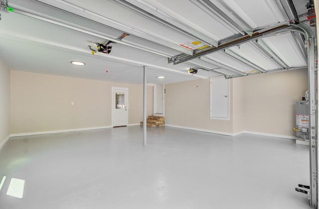 garage with recessed lighting, a garage door opener, baseboards, and gas water heater