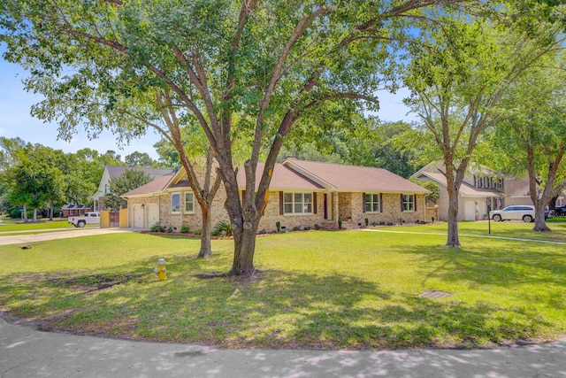 ranch-style home with a garage, a front lawn, and concrete driveway