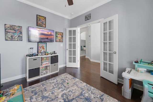 interior space featuring french doors, dark hardwood / wood-style floors, crown molding, and ceiling fan