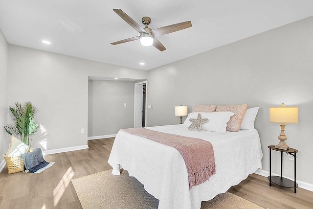 bedroom featuring ceiling fan and light hardwood / wood-style floors