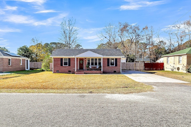 single story home featuring a front lawn