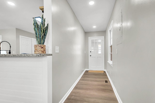 doorway featuring hardwood / wood-style flooring and sink