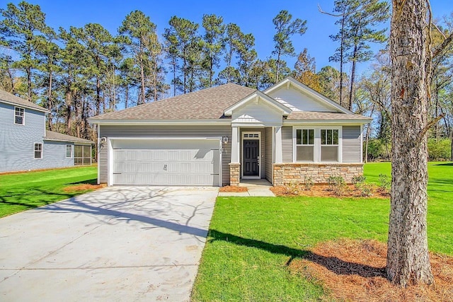 view of front of home with a garage and a front yard