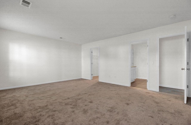 spare room with carpet floors