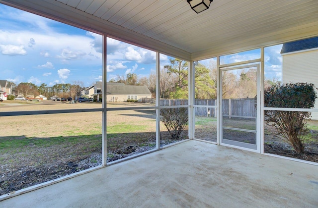 unfurnished sunroom with plenty of natural light