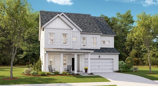 view of front of house with a front yard and a garage