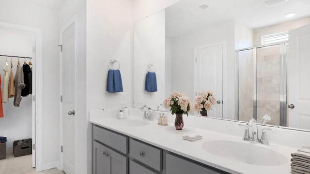 bathroom with vanity and walk in shower