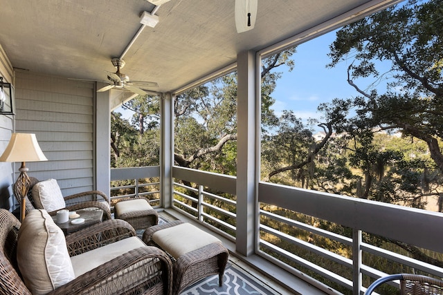 sunroom with a wealth of natural light and ceiling fan