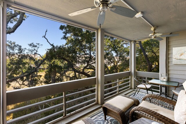 sunroom / solarium with ceiling fan