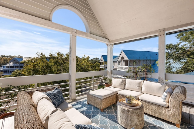 view of patio with an outdoor hangout area and a balcony