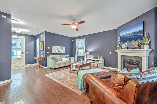 living room with ceiling fan and hardwood / wood-style floors