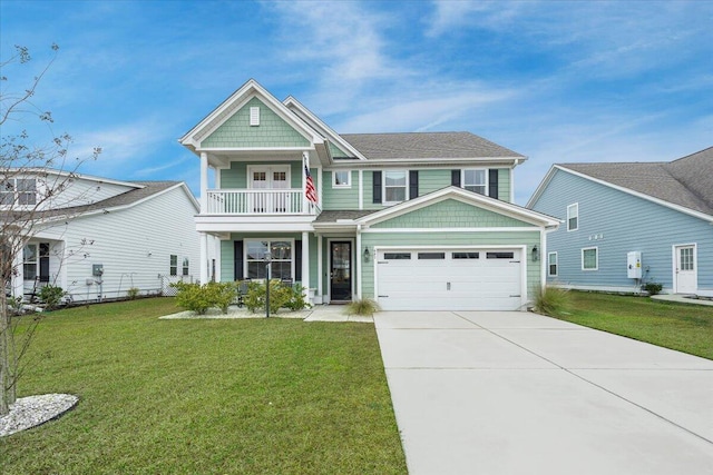 view of front of home with concrete driveway, an attached garage, a balcony, and a front lawn