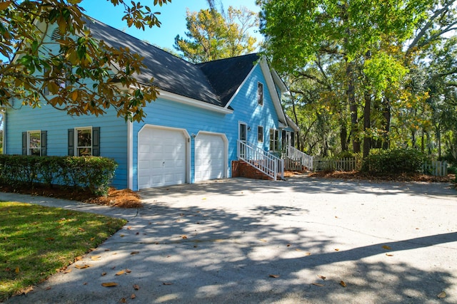 view of side of property featuring a garage