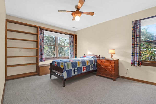 carpeted bedroom featuring ceiling fan